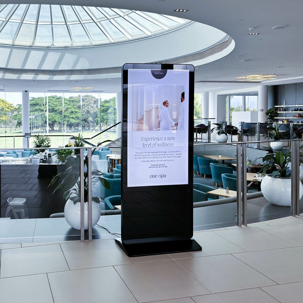 Digital poster stand at Royal Pines resort.
