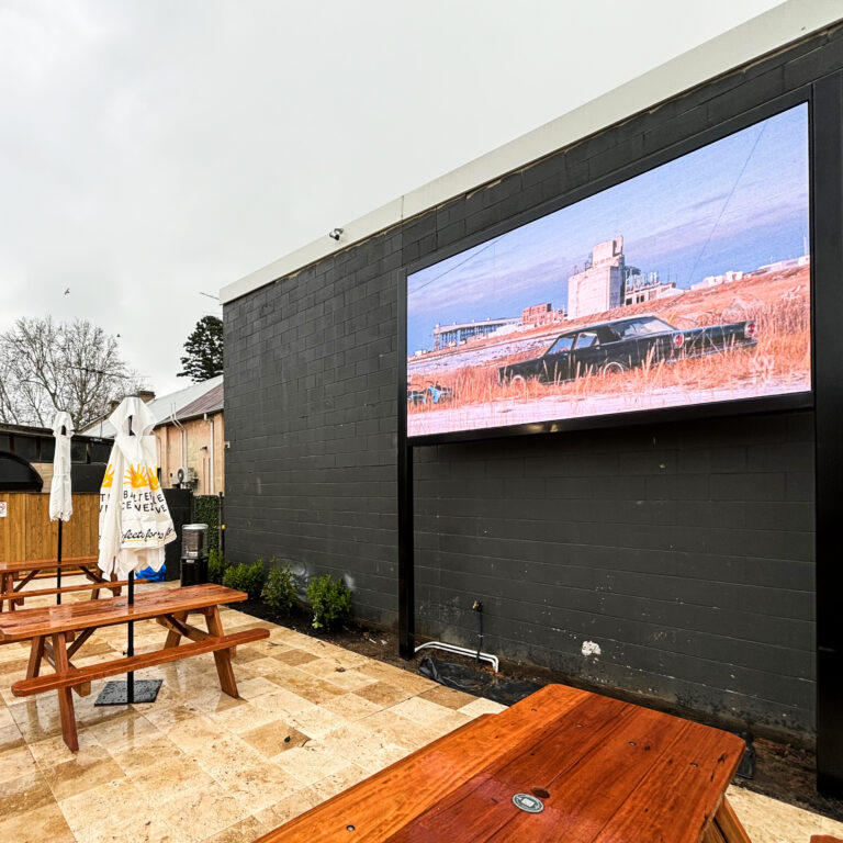 Outdoor LED digital signage at a pub courtyard in Australia
